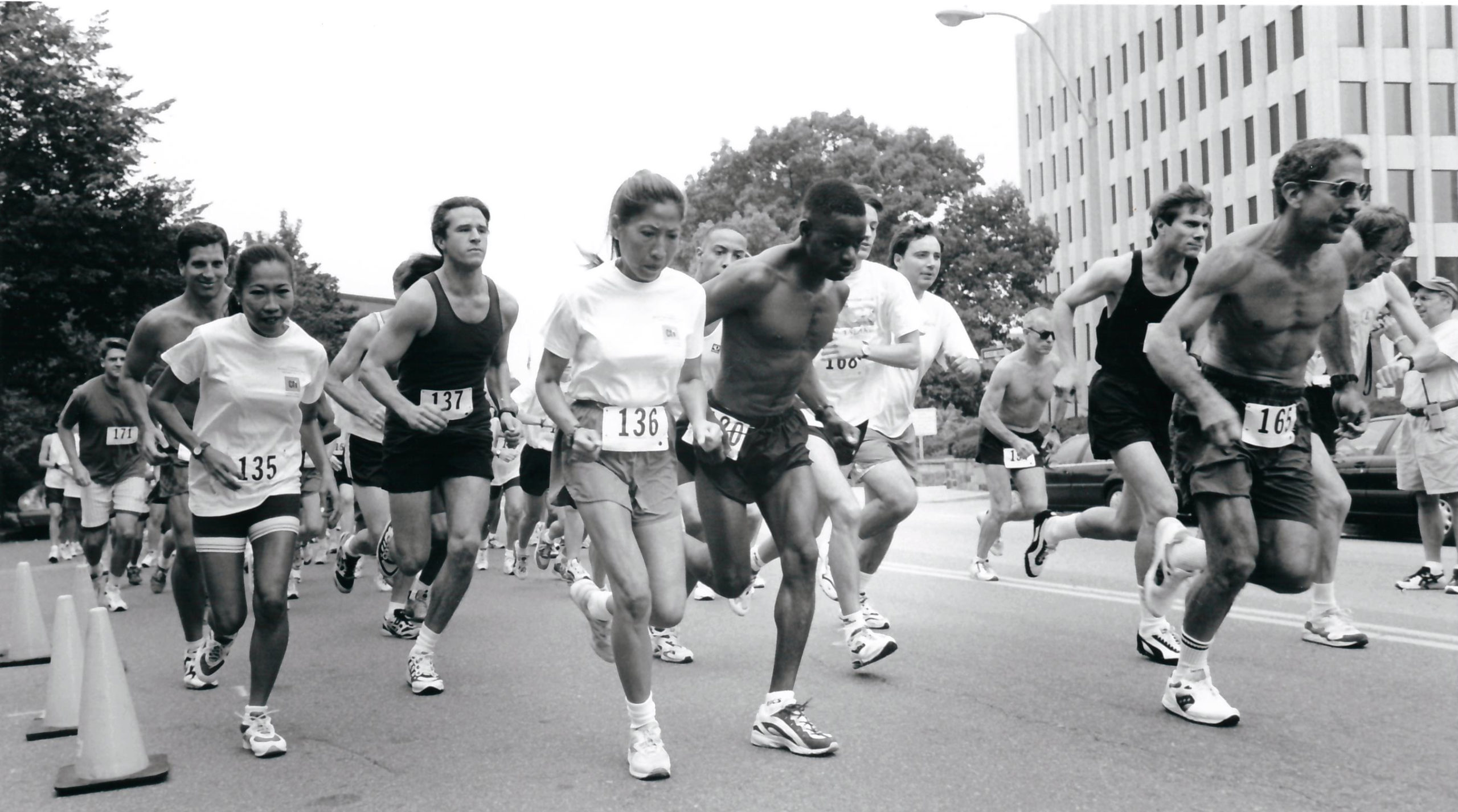 Black and white picture of road race benefitting HIV organizations